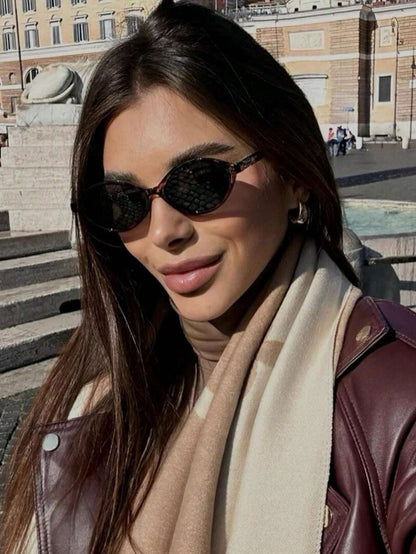 Retro Chic Black Oval Sunglasses with Gold Detail